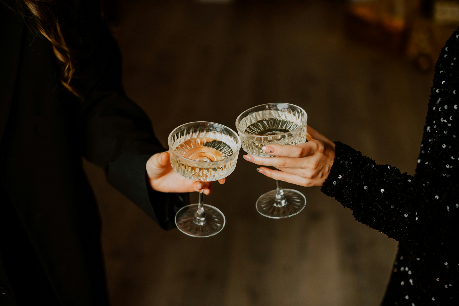 Toasting with champagne coupes